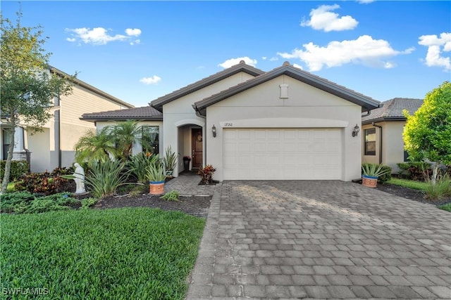 17152 Ashford Ter, Fort Myers, FL 33967 - single story home featuring stucco siding, an attached garage, and decorative driveway
