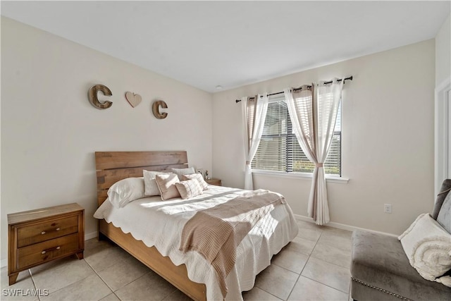 17152 Ashford Ter, Fort Myers, FL 33967 - bedroom featuring light tile patterned flooring and baseboards