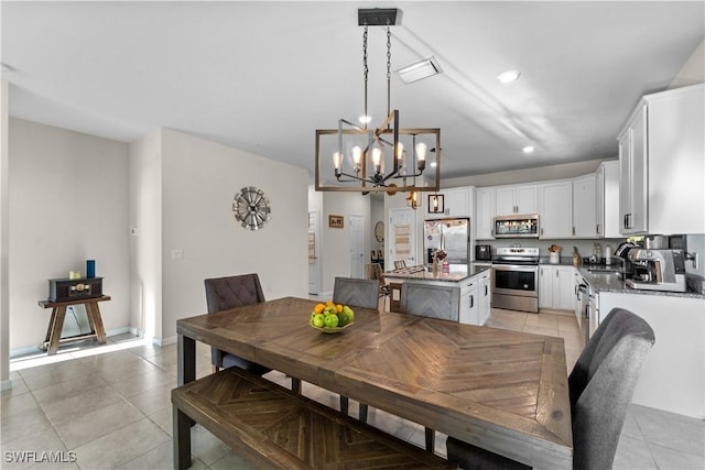 17152 Ashford Ter, Fort Myers, FL 33967 - dining room with light tile patterned floors, a chandelier, and recessed lighting