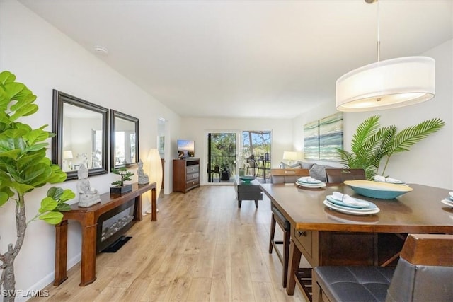 dining area with light wood-style floors