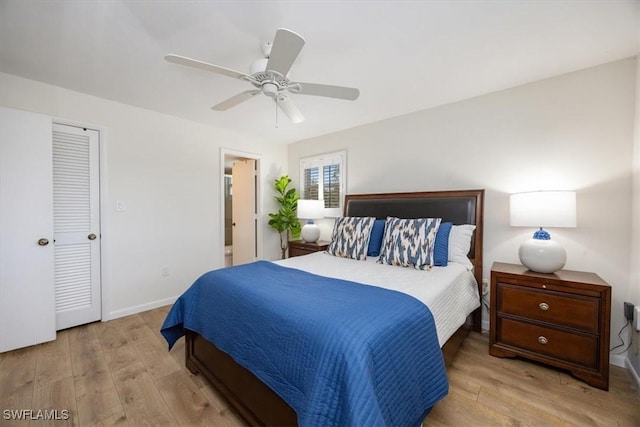 bedroom featuring ceiling fan, wood finished floors, and baseboards