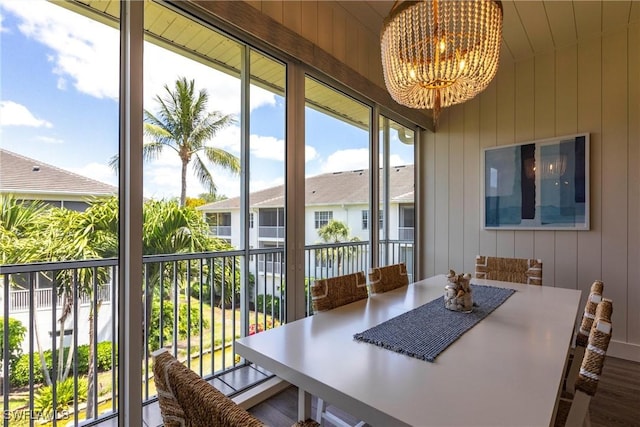 831 Sailaway Ln Unit 203, Naples, FL 34108 - sunroom with a chandelier