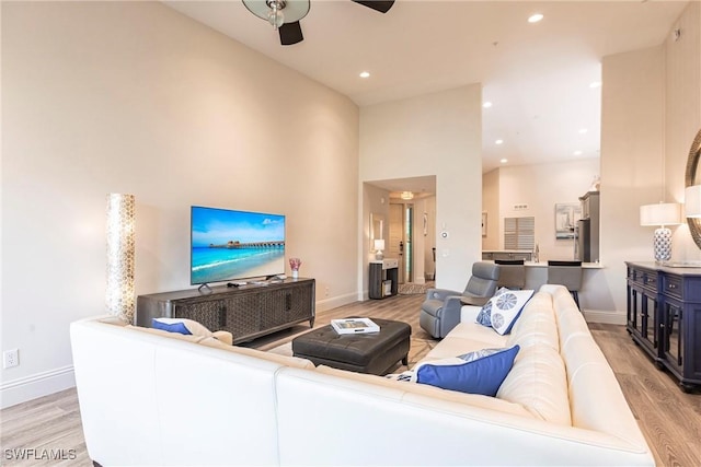831 Sailaway Ln Unit 203, Naples, FL 34108 - living room with light wood-style flooring, ceiling fan, baseboards, and recessed lighting