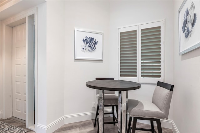 831 Sailaway Ln Unit 203, Naples, FL 34108 - dining room with wood finished floors and baseboards
