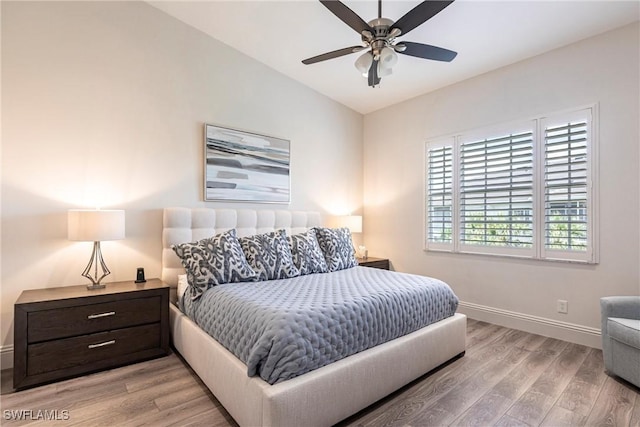 831 Sailaway Ln Unit 203, Naples, FL 34108 - bedroom featuring baseboards, lofted ceiling, light wood finished floors, and ceiling fan