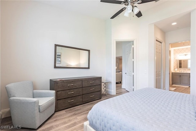 831 Sailaway Ln Unit 203, Naples, FL 34108 - bedroom with ensuite bath, light wood-style flooring, recessed lighting, and a ceiling fan