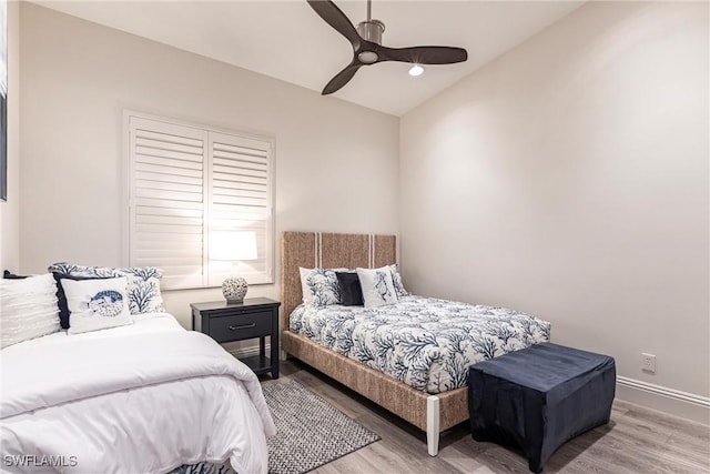 831 Sailaway Ln Unit 203, Naples, FL 34108 - bedroom with wood finished floors, a ceiling fan, and baseboards