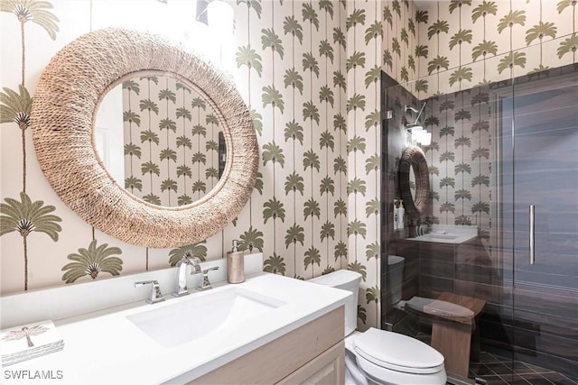 831 Sailaway Ln Unit 203, Naples, FL 34108 - full bathroom featuring wallpapered walls, vanity, toilet, and a shower stall