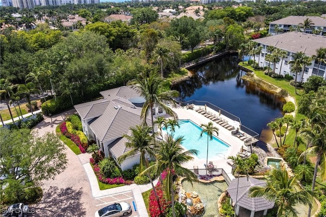 831 Sailaway Ln Unit 203, Naples, FL 34108 - bird's eye view of a large body of water, a pool area, and a tree filled landscape