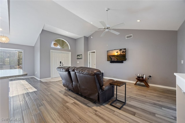 living room featuring visible vents, a ceiling fan, light wood finished floors, and baseboards