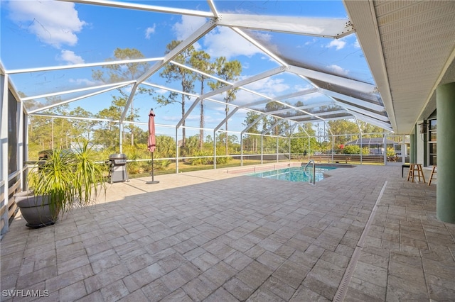 outdoor pool with a patio and a lanai
