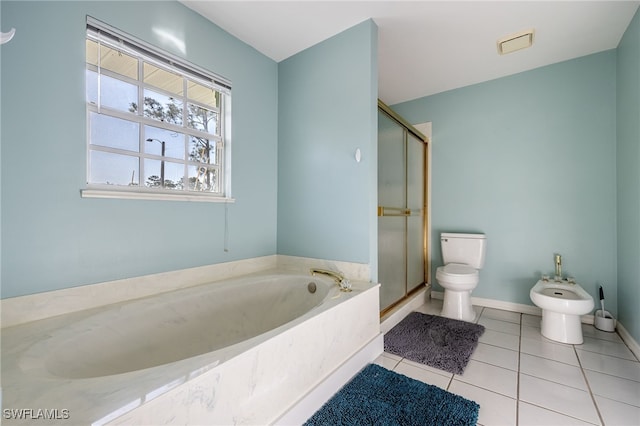 full bath featuring a shower stall, a bath, toilet, tile patterned flooring, and a bidet