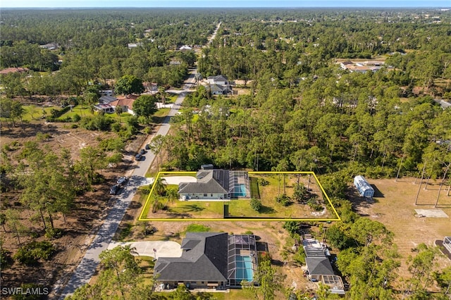 aerial view featuring a view of trees