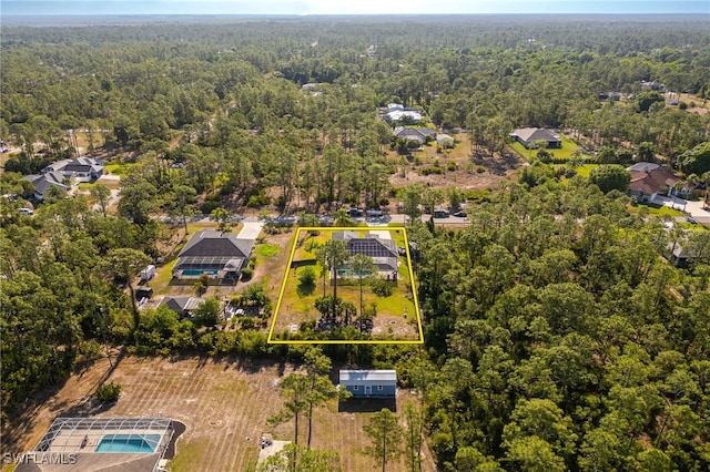 aerial view with a wooded view