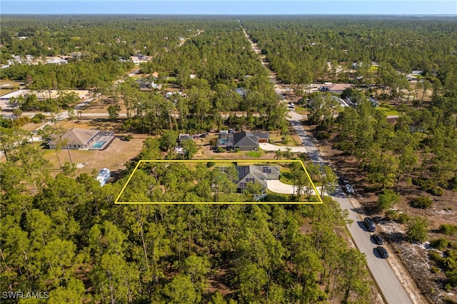 aerial view with a wooded view