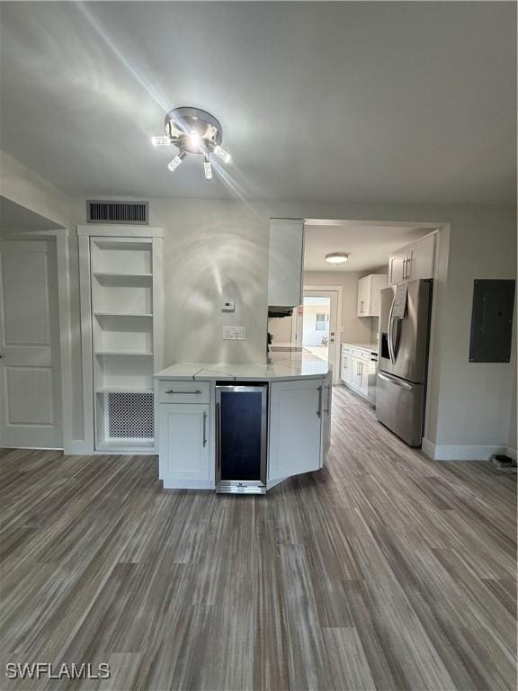 530 Broad Ave S Unit 530, Naples, FL 34102 - kitchen featuring white cabinetry, beverage cooler, visible vents, baseboards, and stainless steel fridge with ice dispenser