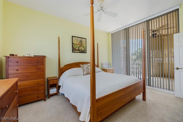 bedroom featuring access to exterior, light carpet, and ceiling fan