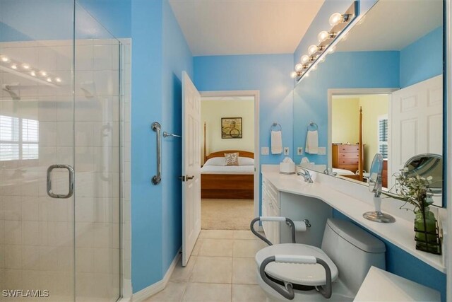 full bath featuring a shower stall, ensuite bath, tile patterned flooring, and a sink