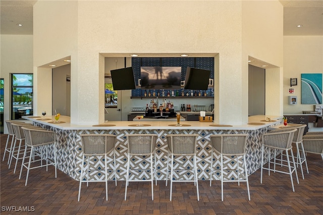 12389 Dahlia Ct, Naples, FL 34120 - indoor wet bar with a towering ceiling
