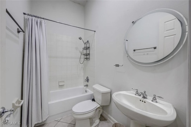 8442 Mallards Way, Naples, FL 34114 - bathroom with tile patterned flooring, a sink, baseboards, toilet, and shower / tub combo with curtain