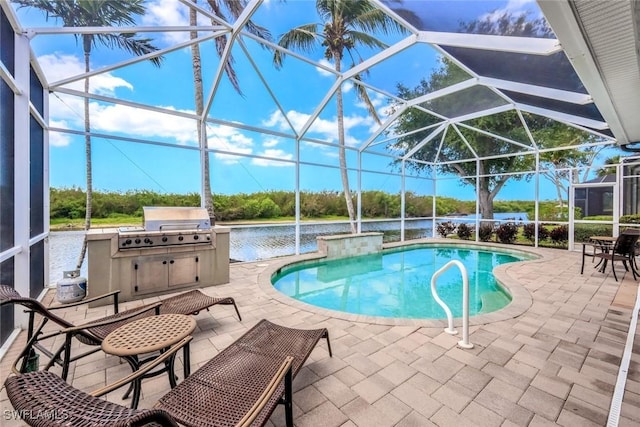 8442 Mallards Way, Naples, FL 34114 - outdoor pool featuring grilling area, a patio, a water view, and exterior kitchen