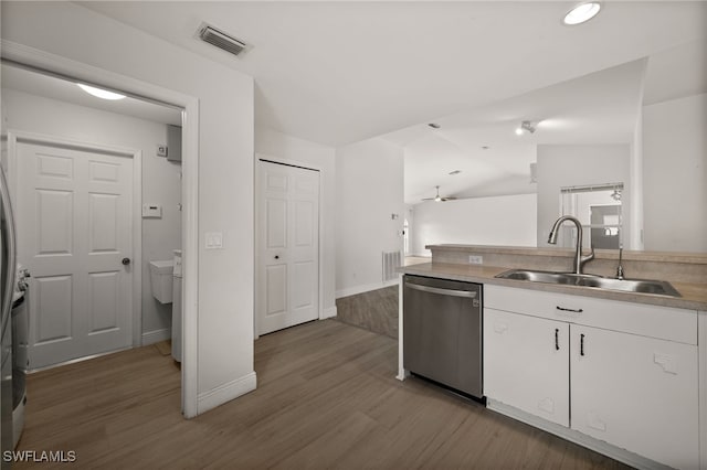 kitchen featuring a sink, wood finished floors, white cabinetry, and dishwasher