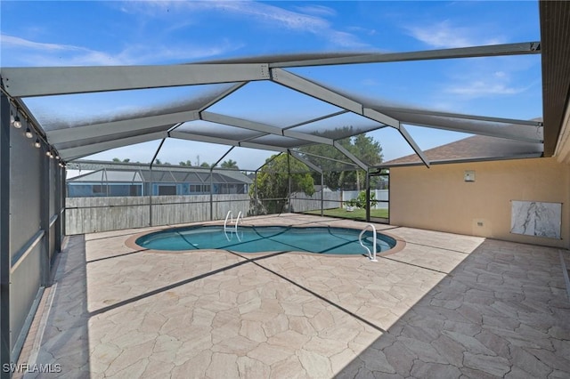 view of swimming pool featuring a fenced in pool, fence, and a patio