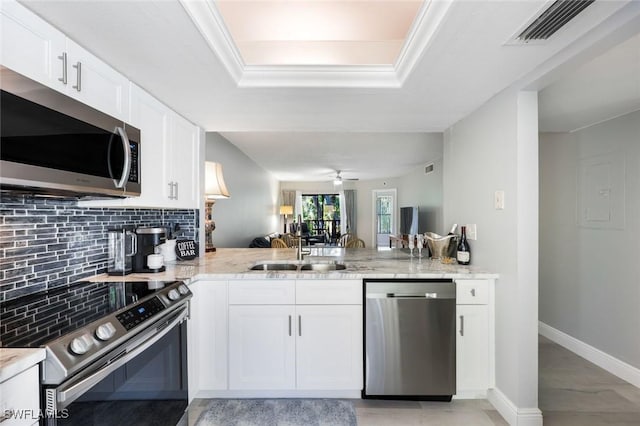 15177 Parkside Dr Unit 104, Fort Myers, FL 33908 - kitchen with light stone counters, decorative backsplash, stainless steel appliances, a sink, and visible vents