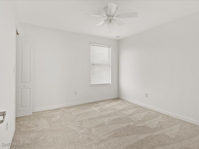 2478 Heydon Cir E, Naples, FL 34120 - carpeted spare room with baseboards and a ceiling fan