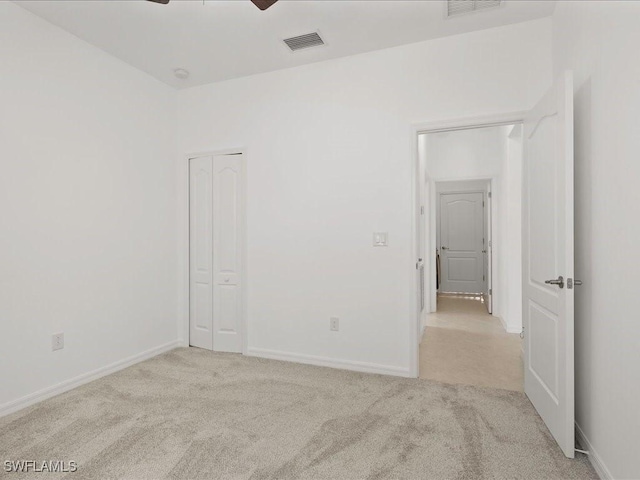 2478 Heydon Cir E, Naples, FL 34120 - carpeted spare room featuring baseboards, visible vents, and ceiling fan