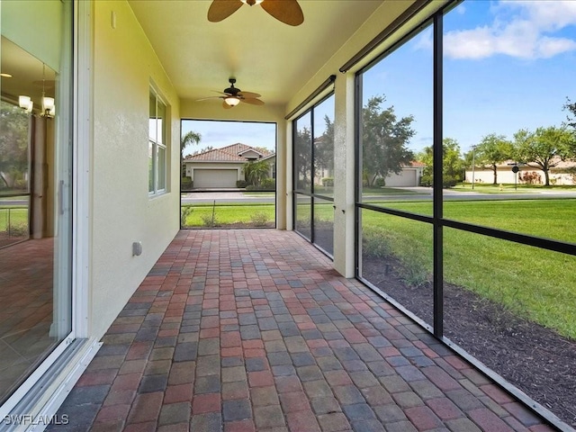 2478 Heydon Cir E, Naples, FL 34120 - unfurnished sunroom featuring a ceiling fan