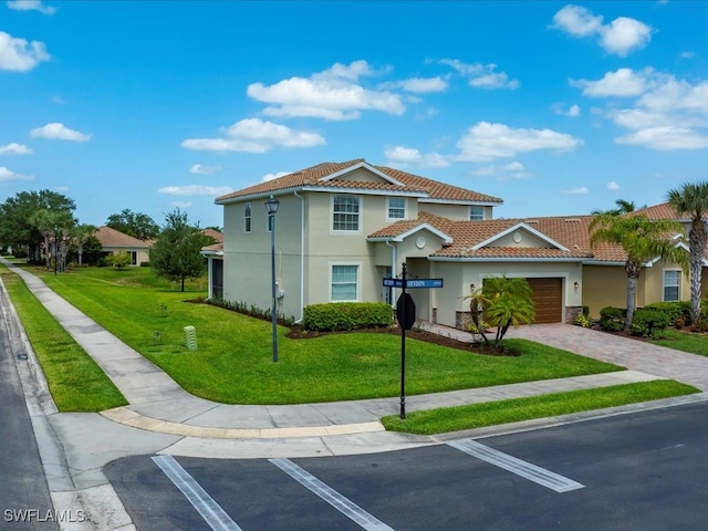 2478 Heydon Cir E, Naples, FL 34120 - view of front of property featuring stucco siding, a tiled roof, an attached garage, and a front lawn