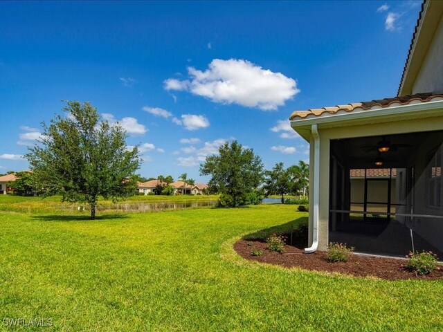 2478 Heydon Cir E, Naples, FL 34120 - view of yard with a water view and a sunroom