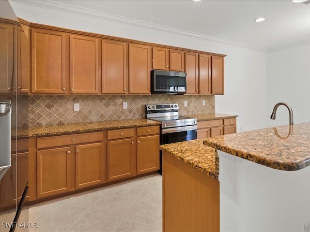 2478 Heydon Cir E, Naples, FL 34120 - kitchen with stone counters, appliances with stainless steel finishes, decorative backsplash, and brown cabinets