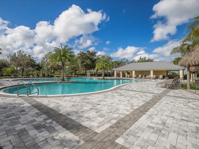 2478 Heydon Cir E, Naples, FL 34120 - pool featuring a patio