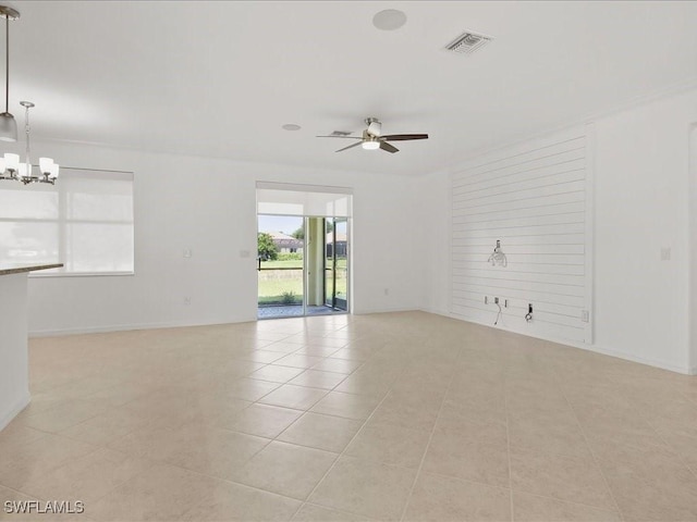 2478 Heydon Cir E, Naples, FL 34120 - empty room featuring light tile patterned flooring, visible vents, and ceiling fan with notable chandelier