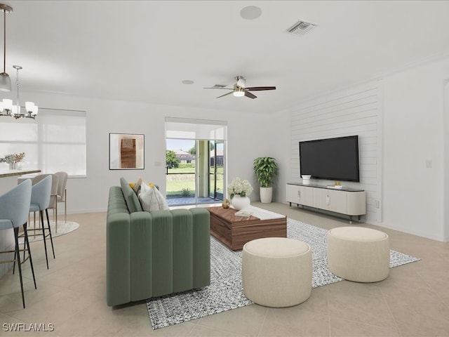 2478 Heydon Cir E, Naples, FL 34120 - living room with visible vents, baseboards, tile patterned floors, and ceiling fan with notable chandelier