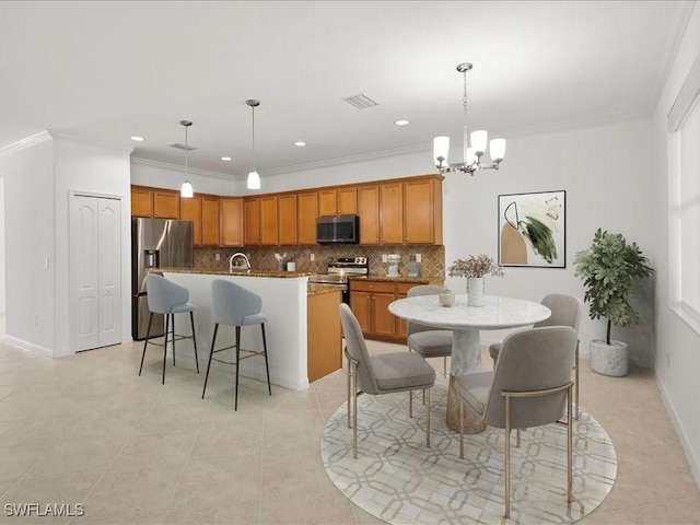 2478 Heydon Cir E, Naples, FL 34120 - dining room with an inviting chandelier, light tile patterned floors, visible vents, and crown molding