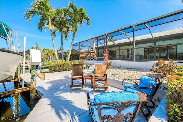 937 SW 54th Ln, Cape Coral, FL 33914 - exterior space with a boat dock, boat lift, and glass enclosure