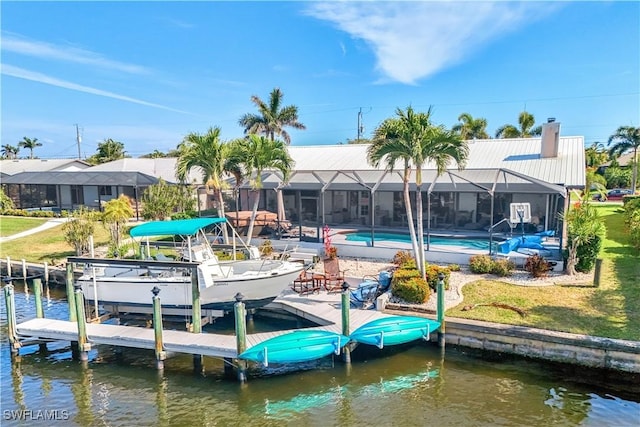 937 SW 54th Ln, Cape Coral, FL 33914 - dock area with a water view, boat lift, a yard, an outdoor pool, and glass enclosure