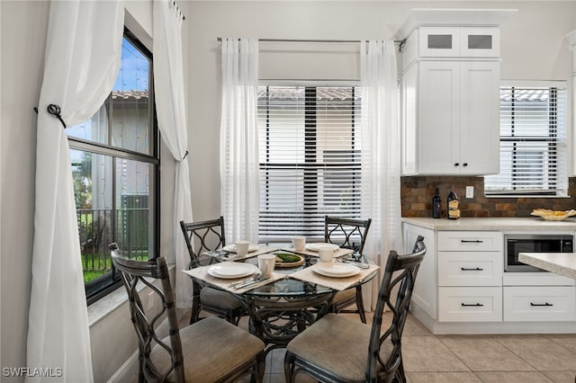 dining space with light tile patterned floors