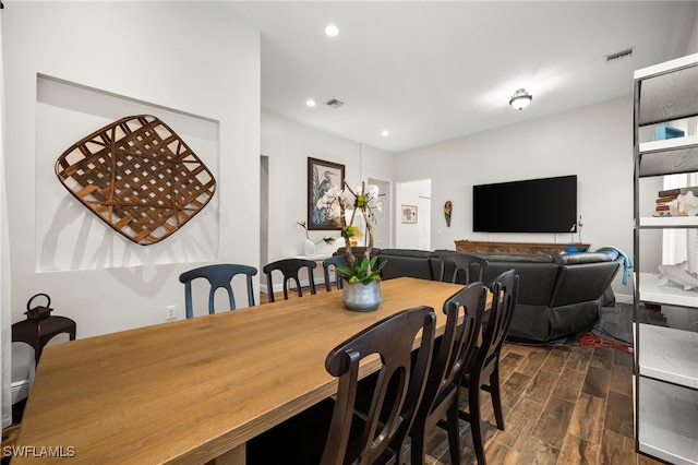 dining room with visible vents, recessed lighting, and wood tiled floor
