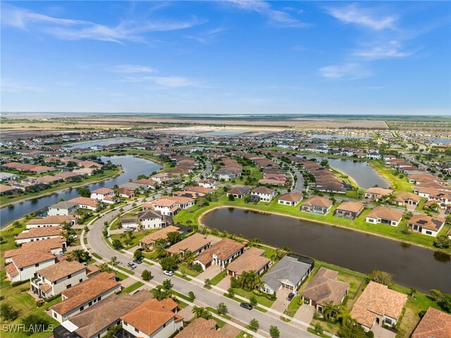 bird's eye view with a residential view and a water view