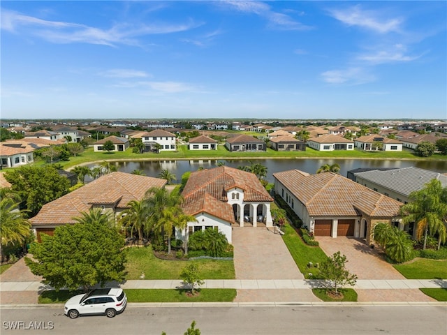 bird's eye view featuring a residential view and a water view