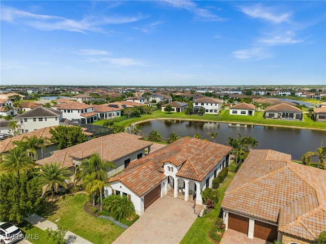 bird's eye view with a residential view and a water view