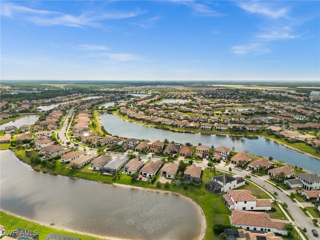 bird's eye view featuring a residential view and a water view