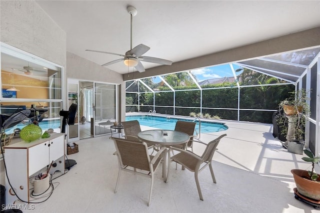 pool with a lanai, ceiling fan, and a patio area