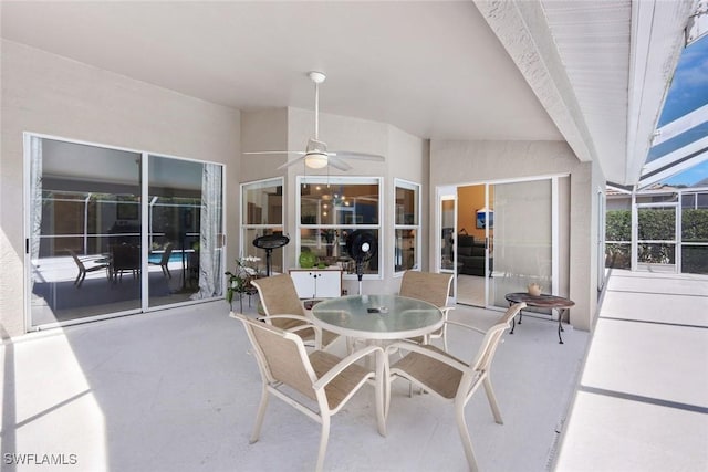 view of patio / terrace with ceiling fan and outdoor dining space