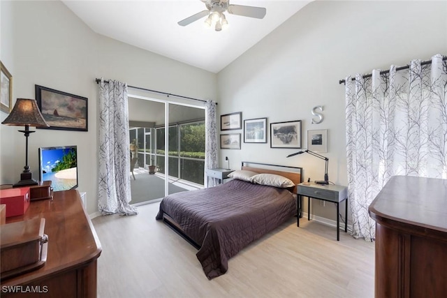 bedroom featuring high vaulted ceiling, wood finished floors, access to outside, and a ceiling fan