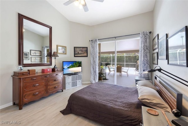 bedroom featuring access to exterior, ceiling fan, wood finished floors, and baseboards